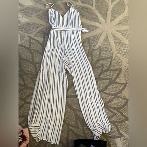 White with black pinstripes, spaghetti strap jumpsuit wide legged side slips